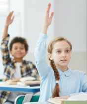 children-raising-hands-in-school.jpg
